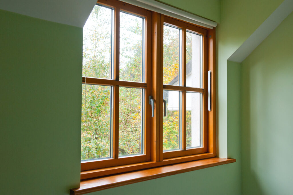 Double glazed wooden window frame in the home in the autumn