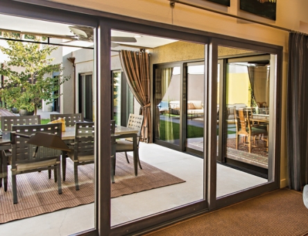 Gray-framed sliding glass doors leading out to a large patio.