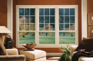 Three double-hung windows in a living room.