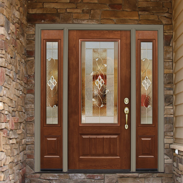 Woodgrain fiberglass front door with decorative glass and sidelites in a tan brick home.