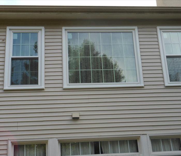 Large panel window with two energy efficient windows on the sides