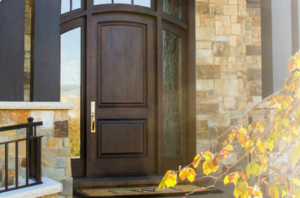Dark wood-grain ENERGY STAR front door outside view with decorative sidelites.